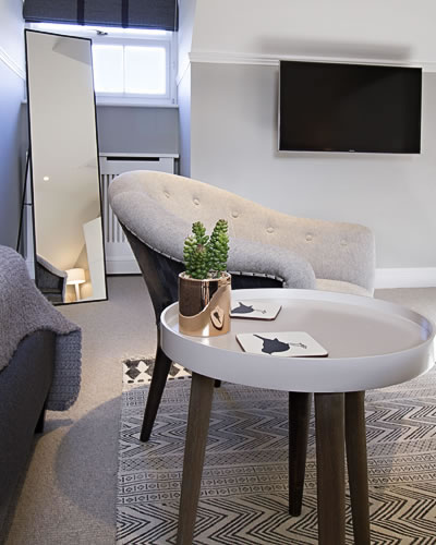 Armchair and table in bedroom